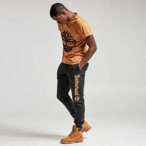 Apricot Tee With Black Sweatpants and Khaki Work Boots